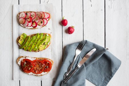 Vegetable sandwiches with radish, avocado and tomato, healthy vegetarian snackの写真素材