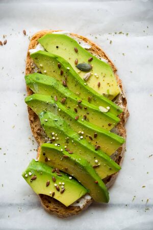 Vegetable sandwich with radish, avocado and tomato, healthy vegetarian snack