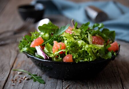 Green light vegetable salad with arugula and grapefruitの写真素材