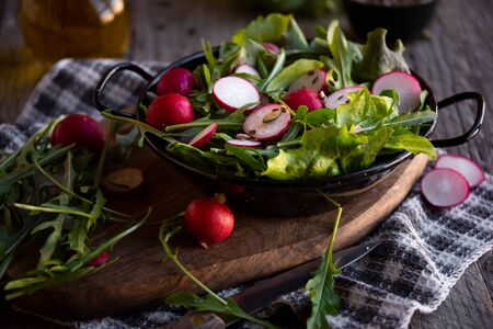 Vegetable salad with radish, arugula and lettuceの写真素材
