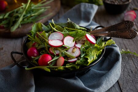 Fresh vegetable salad with radish, arugula and lettuceの写真素材