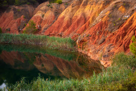 Colorful bauxite quarry lake in Apulia, Italy