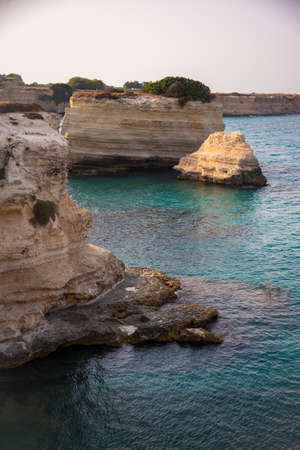 Beautiful rocky sea coast in Italy with clear waterの写真素材