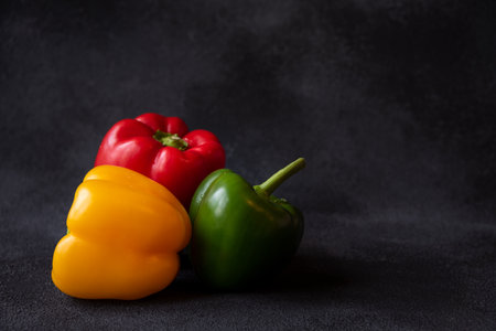 Fresh bell peppers of different colors, healthy vegetable vitaminsの写真素材