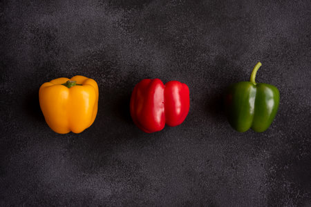 Fresh bell peppers of different colors, healthy vegetable vitaminsの写真素材
