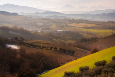 Countryside landscape in autumn, agricultural fields among hills