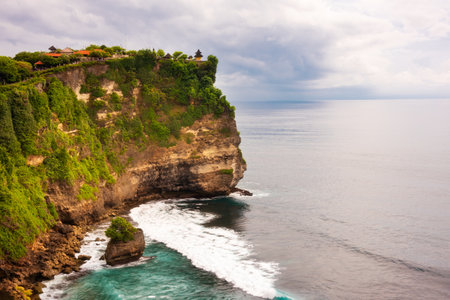 Uluwatu cliff on ocean coast on Bali island, Indonesiaの写真素材