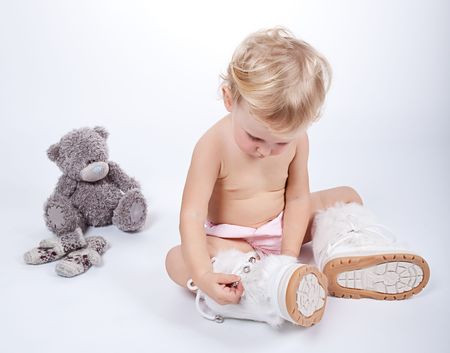 beautiful child girl playing with toys and her motherの写真素材