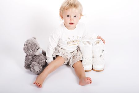 beautiful child girl playing with toys and her motherの写真素材