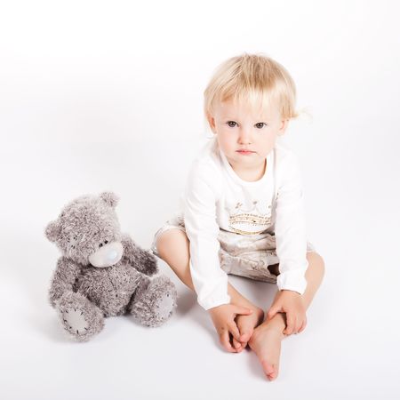 beautiful child girl playing with toys and her motherの写真素材