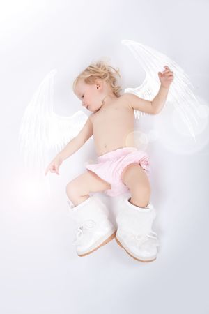 beautiful child girl playing with toys and her motherの写真素材