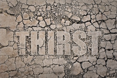 The word thirst written on the dried groundの写真素材