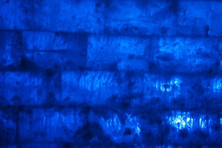 wall of ice brick with blue backlightの写真素材