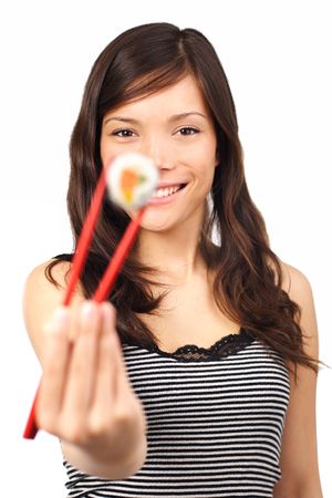 Pretty young woman holding a salmon maki sushi. Shallow depth of field, focus on models face. Isolated on white.の写真素材