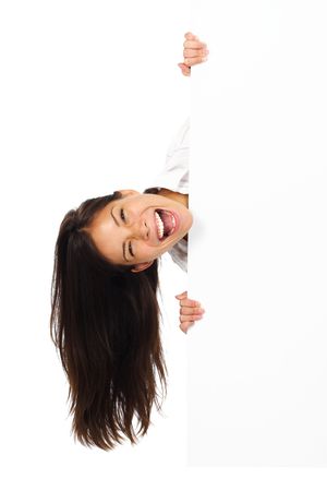 Very excited woman holding billboard / blank sign. Isolated on white.の写真素材