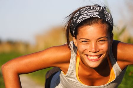 Closeup of  woman doing push-ups during an outdoor exercise a summer night in denmark.の写真素材