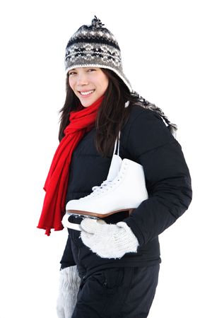 Ice skating. Beautiful woman going ice skating. Isolated on white background. Natural cold light.の写真素材