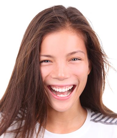 Sporty asian woman with a grin after exercise. Isolated on white background.の写真素材