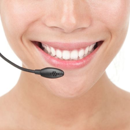 Closeup of beautiful woman with headset. の写真素材