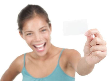  Beautiful young woman with a very excited big smile showing a white business card / notecard. Sの写真素材