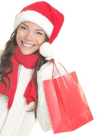 Christmas shopping woman isolated on white background.の写真素材