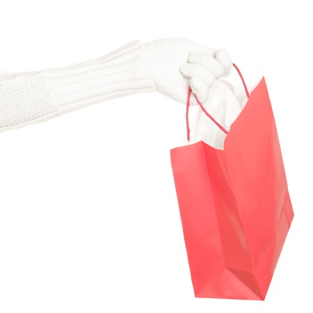 Red Christmas winter shopping bag isolated on white background.の写真素材