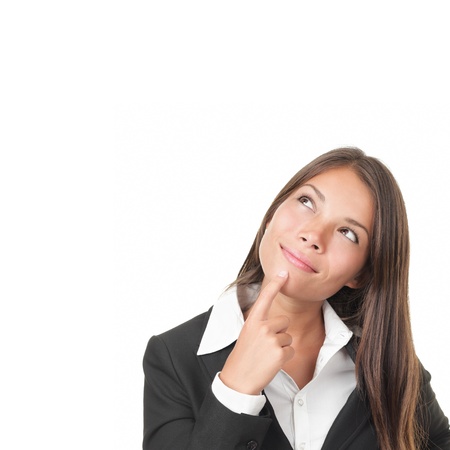 Portrait of woman thinking pensive looking up at copy space. Beautiful young woman Isolated on white backgroundの写真素材