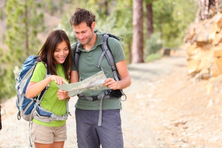 hiking - hikers looking at map. の写真素材