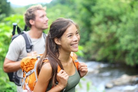 happy hiker couple trekking as part of healthy lifestyle outdoors activityの写真素材