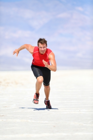 man running sprinting outdoor in desert natureの写真素材