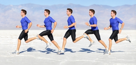 Running man - runner in speed showing sprinting motion. Male sport athlete sprinter composite in beautiful nature landscape. Fit fitness model in fast sprint run in desert outdoor.の写真素材