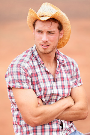 Cowboy man handsome and good looking with hat in rural USA countrysideの写真素材