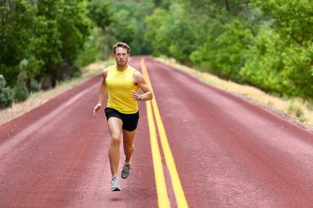 Running man runner sprinting for fitness and health. 