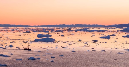 Ice and Icebergs from glacier - amazing arctic nature landscape aerial image of icefjord filled with...