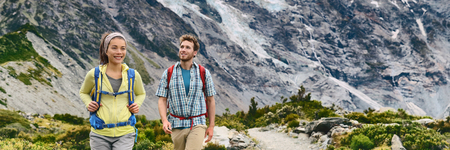New Zealand travel hiking Backpacking hikers walking in mountains nature landscape, panoramic...