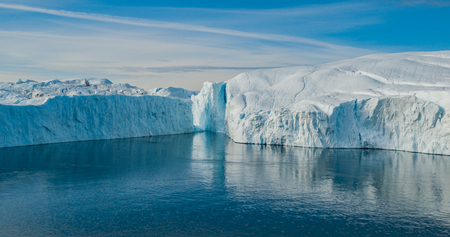 Iceberg aerial photo - giant icebergs in Disko Bay on greenland floating in Ilulissat icefjord from melting glacier Sermeq Kujalleq Glacier, aka Jakobhavns Glacier. Global warming and climate changeの写真素材