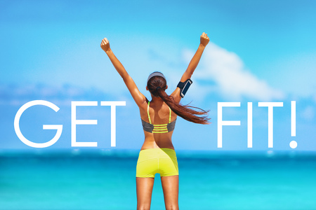 Get FIT motivational message weight loss poster for fitness concept. New Year resolution inspirational quote on beach background. Cheering winner woman with arms up training goal getting in shape.の写真素材