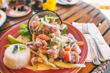 Tahiti food National dish local typical cuisine - Tahitian Raw Fish salad called Poisson Cru in French Polynesia. Top view of hotel restaurant meal in Bora Bora.の写真素材