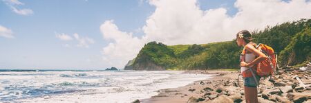 Travel hike woman tourist hiker with backpack on beach banner panorama.の写真素材