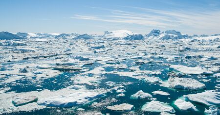 Iceberg and ice from glacier in arctic nature landscape on Greenland. Aerial photo drone photo of...