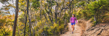 Ultra running race trail competition athlete woman runner on long distance marathon through forest and mountains in New Zealand, banner panorama.の写真素材