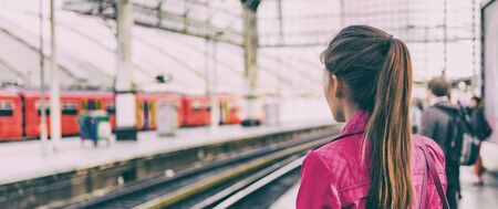 Train commuter woman going to work waiting for delayed tramway at station early morning panoramic...