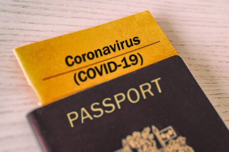 Coronavirus COVID-19 Vaccination proof booklet in passport. Travel ban health certificate Corona screening of travelers tourists. Closure of airports restricted traveling.の写真素材