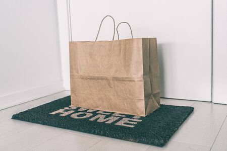 Home delivery of food grocery bag left at door mat for Corona virus spreading safety. Precaution...