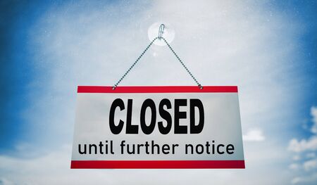 Closed businesses until further notice for COVID-19 , closure sign hanging on storefront window. Government shutdown of restaurants, stores, non essential services leading to bankruptcy unemployment.の写真素材