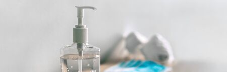 Covid-19 hand sanitizer bottle of alcohol gel and masks banner background for corona virus prevention.の写真素材