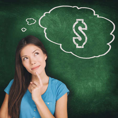 Thought bubble dollar sign drawing young Asian woman thinking of money saving budget how to make profit idea. Illustration on green chalkboard background. Black Friday or Cyber Monday sale shopping.の写真素材