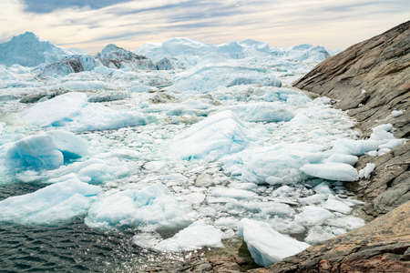 Global warming - Greenland Iceberg landscape of Ilulissat icefjord with giant icebergs. Icebergs...