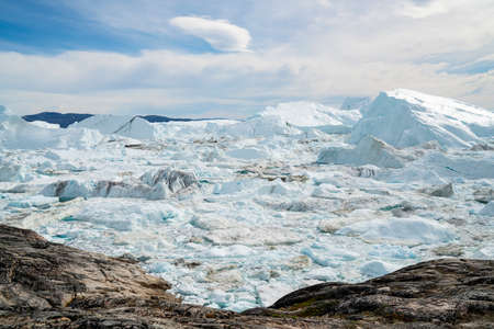 Global warming - Greenland Iceberg landscape of Ilulissat icefjord with giant icebergs. Icebergs...