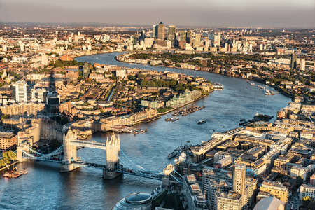 London city skyline aerial view at sunset with The Shard tower shadow, UK, Great Britain. Famous Europe travel destination. Tower bridge and Thames river, popular touristic attractions.の写真素材